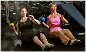 2 women working out together