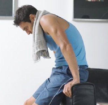 photo of a man resting after a workout